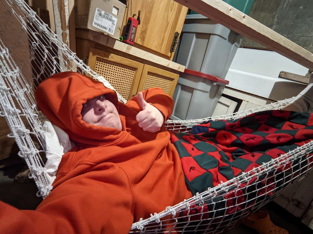 I'm tucked into my hammock down in a cluttered basement room waiting out a storm. Thumbs up.