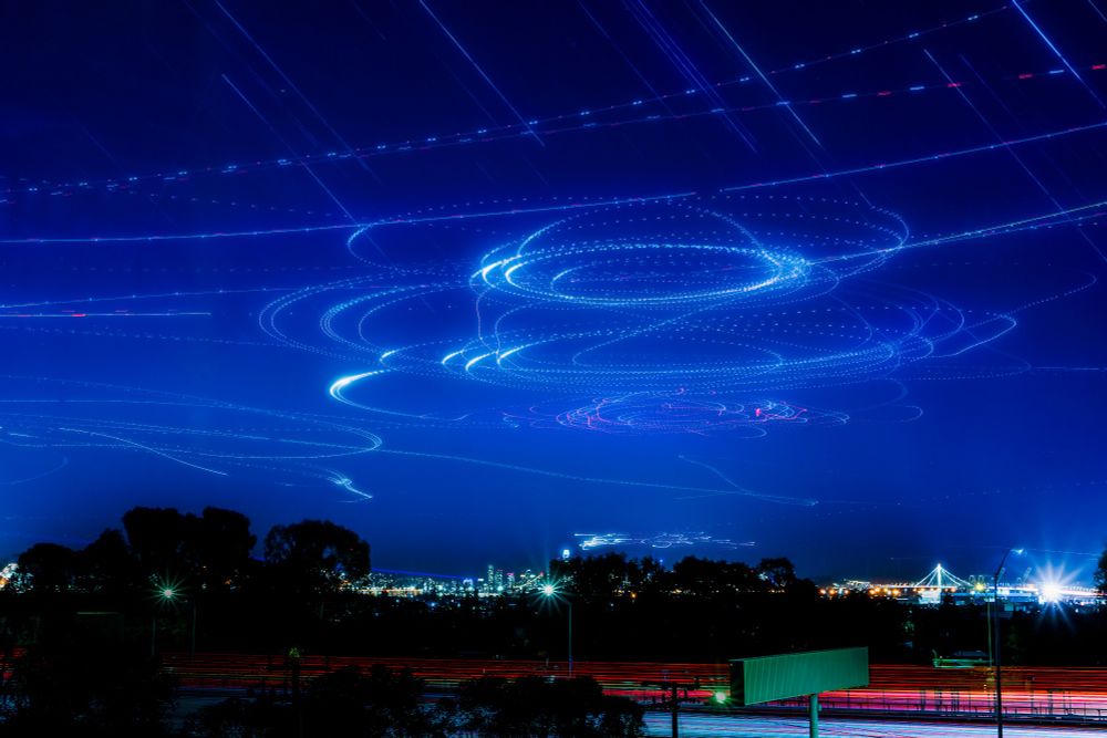 Composite of the sky over San Francisco earlier this evening. You can clearly see the light trails of the various surveillance aircraft over APEC.

Higher altitude trails (5-8k ft) are fixed-wing, the ones over the skyline are helicopters (<1.5k ft).

(Diagonal streaks are stars)