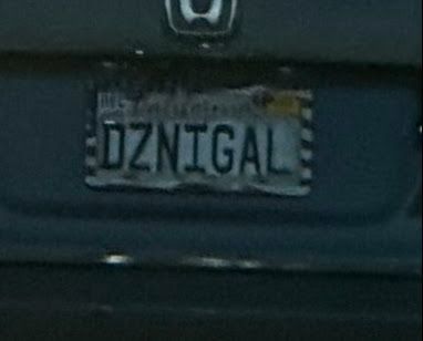 extreme crop of a photo of a CA license plate that reads DZNIGAL
