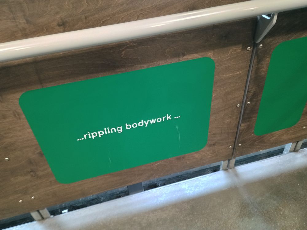 a third sign reading "...rippling bodywork..."