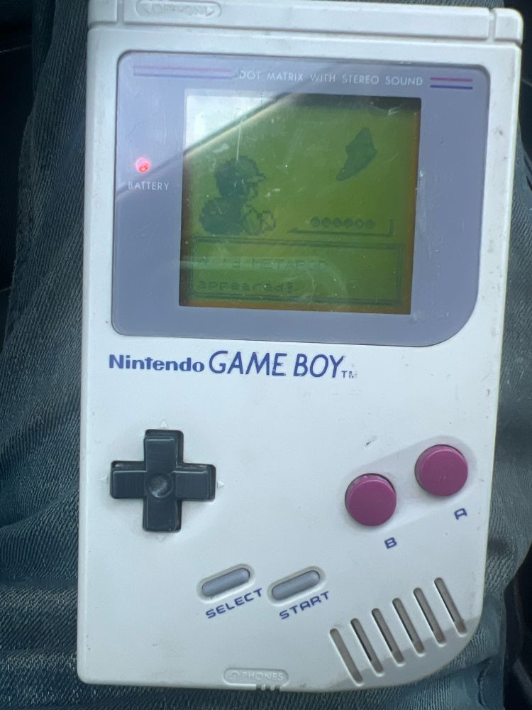 An original Gameboy running Pokemon yellow 