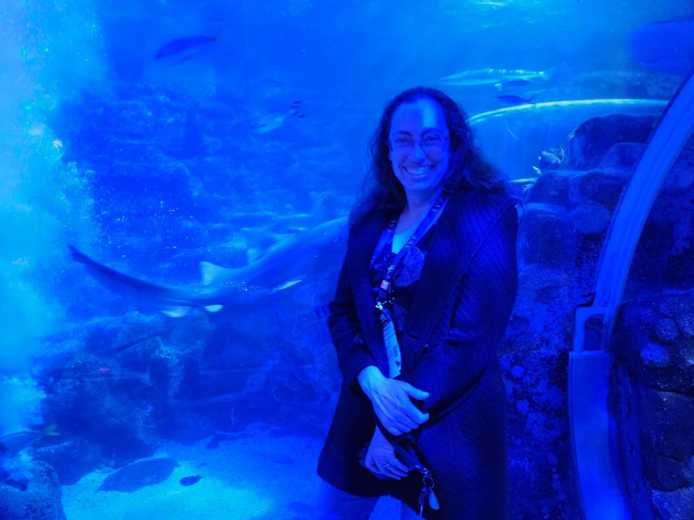 Me on front of a shark tank at Sea Life Birmingham