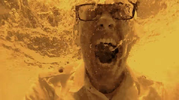 The Angry Video Game Nerd, submerged in yellow liquid