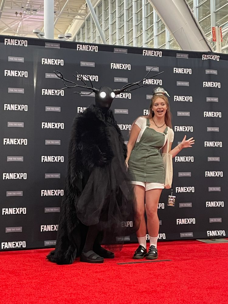Cosplayers dressed as the monster and Greg from Over the Garden Wall