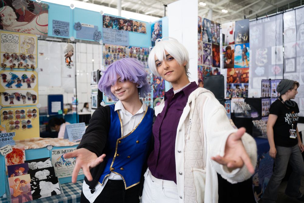 Picture of cosplayers with their arms out at FAN EXPO Boston