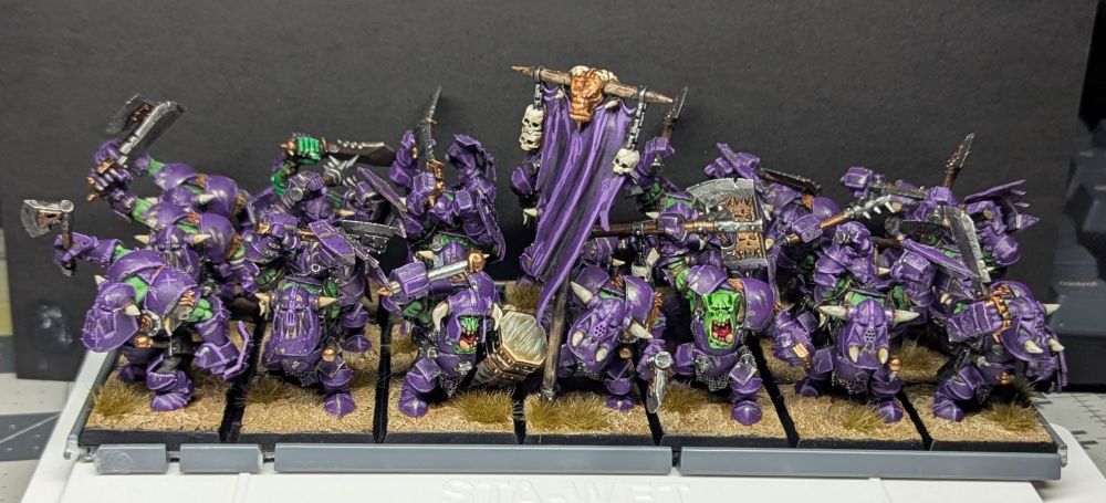 A unit of 21 black orcs, with purple armor.