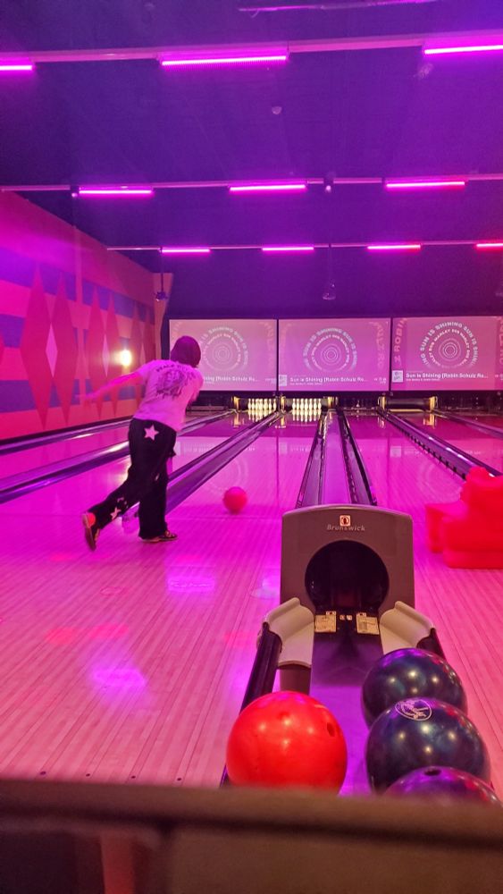 Kid2, of the age of majority, bowling in hot pink lights