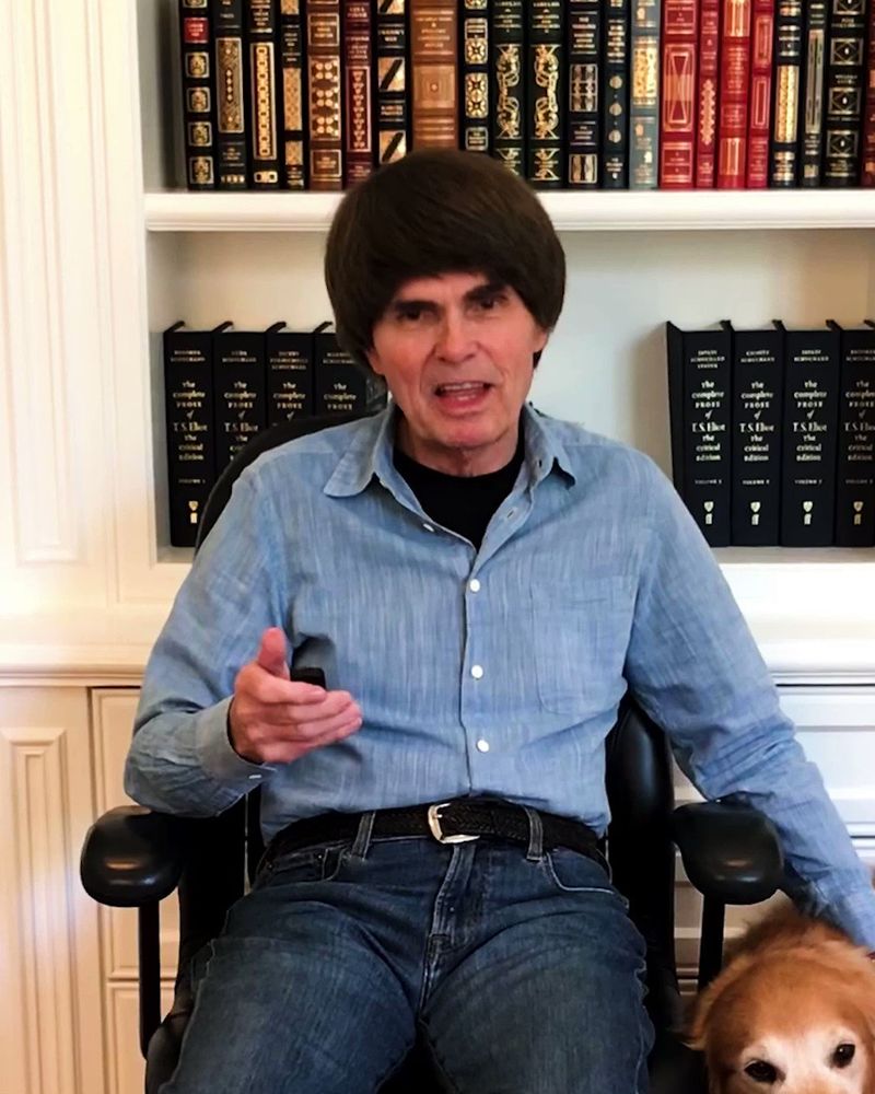 A picture of the famous author Dean Koontz wearing the world’s most obvious wig. Why would an 80 year-old man have a giant crash helmet-shaped, chestnut-coloured mop top rather than grey hair.  Surely a decent income could get you a more convincing hairpiece than one that looks like an overweight Tribble had set up home on your cranium?