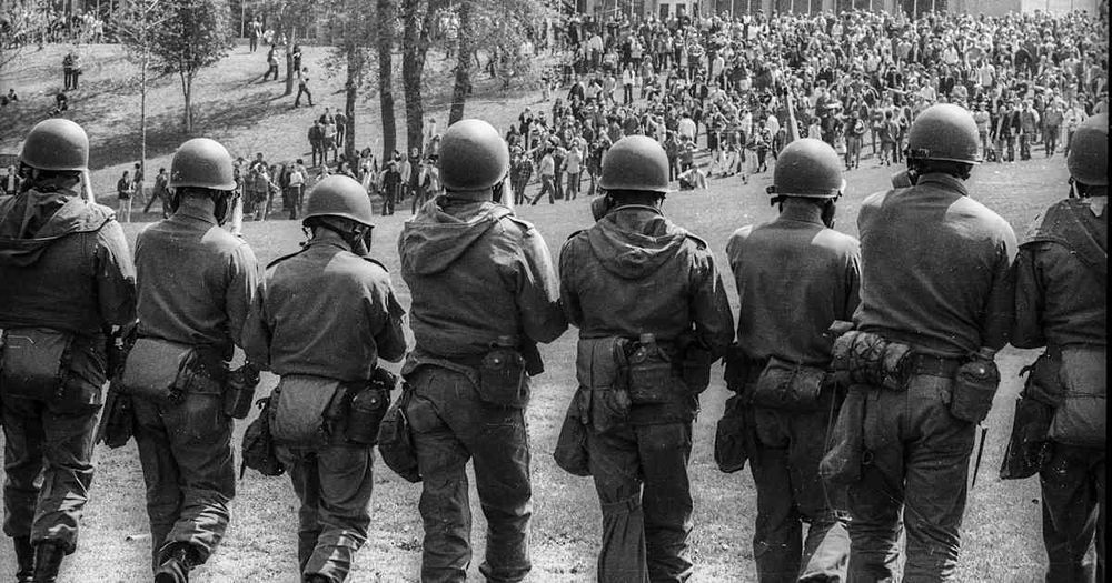 On May 4, 1970, in Kent, Ohio, 28 National Guardsmen fire their weapons at a group of anti-war demonstrators on the K...
