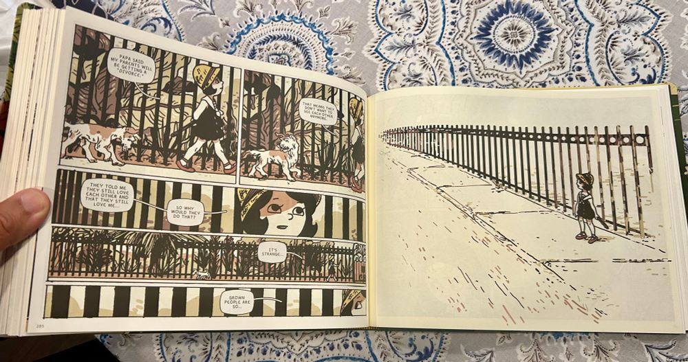 A little girl and a dog walk beside a fence… the dog eventually disappears along with the colours and detail—what’s real and what’s imagined? Spread from Lee Dean’s The Girl Who Flew Away.