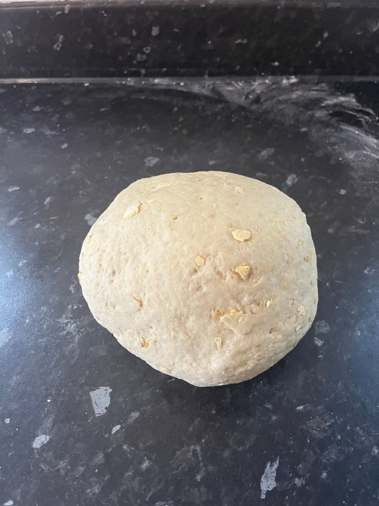 Ball of dough with visible crisp fragments in it