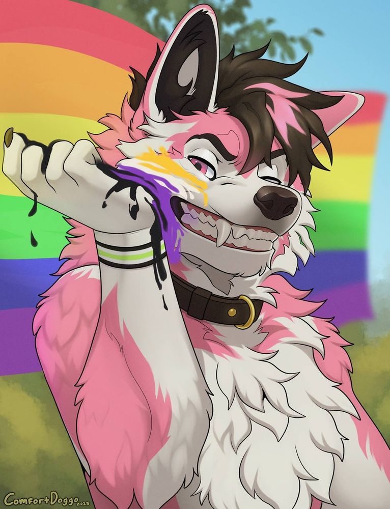 A pink and white malamute, with pink and black hair on top.

There is a pride flag behind them, an agender bracelet on their right wrist, and they're smearing non-binary pride colors onto their cheek.