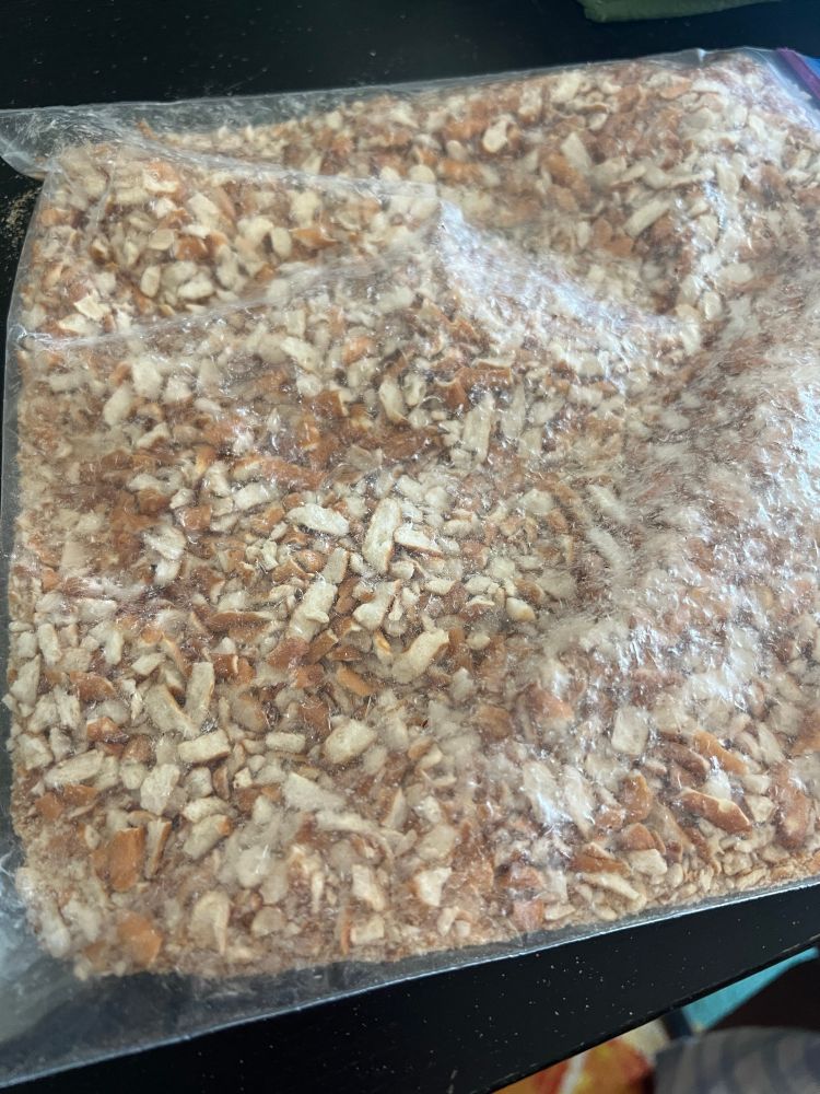 A large ziploc bag full of crushed pretzels