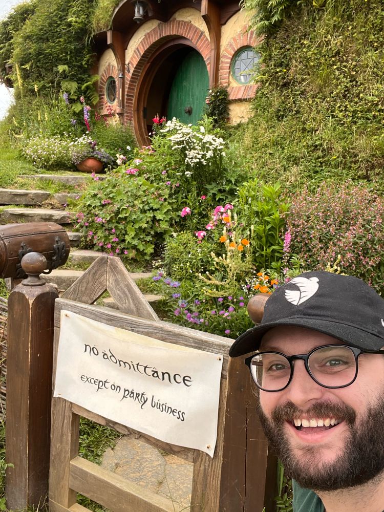 sky is smiling in front of a sign that read “no admittance, except on party business”