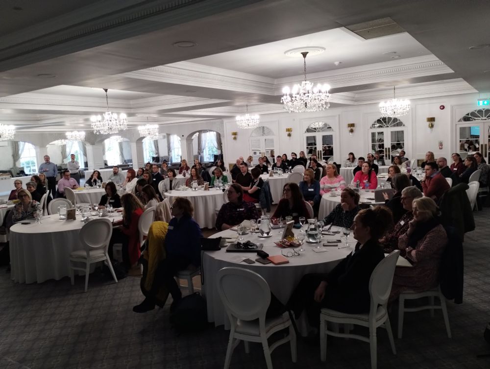 Event participants sitting at round tables