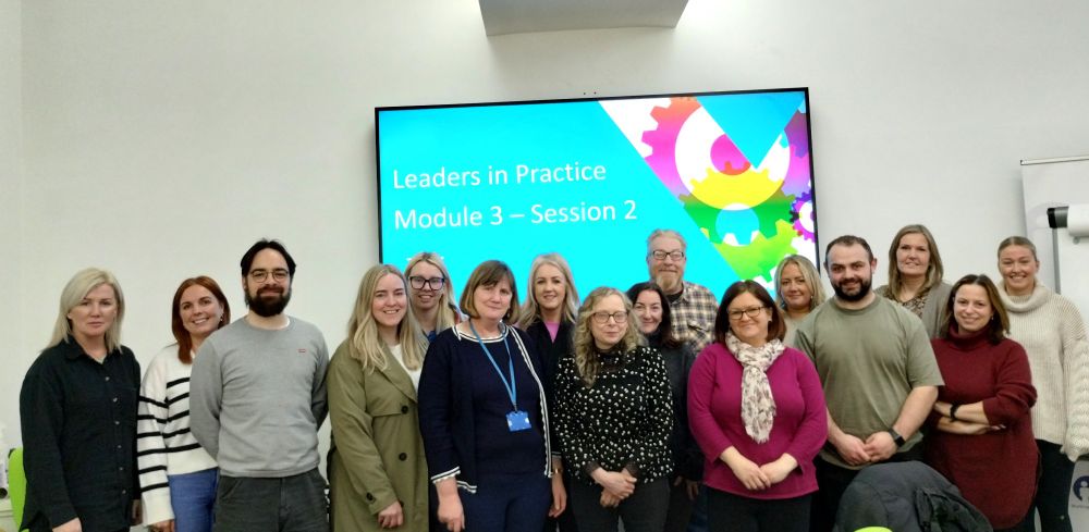 Chief Social Work Officer, Aine Morrison with a group of social worker participants on the Leaders in Practice course. 