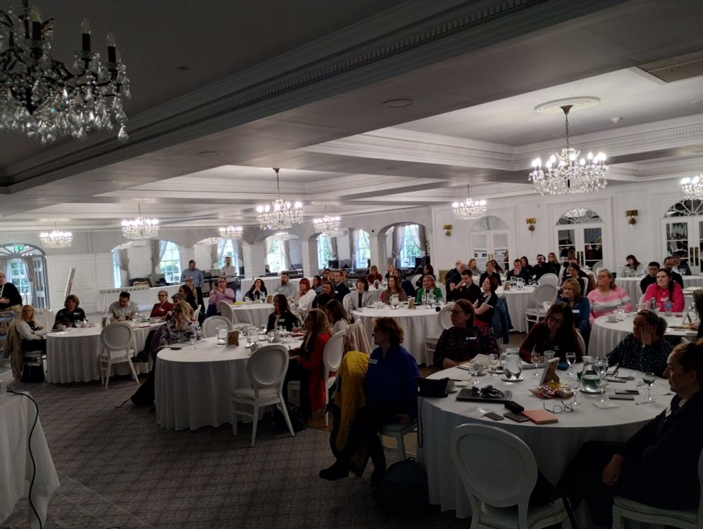 Event participants sitting at round tables