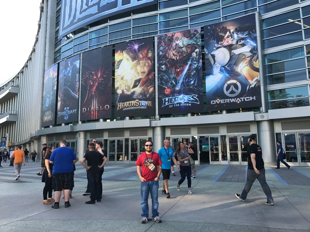 Me in front of the anaheim convention center under the Blizzcon posters in 2016
