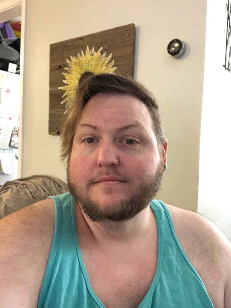 Another photo of a fat bearded dude. Less of a smile this time.