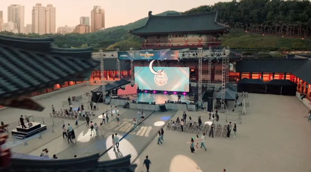 Wide shot of Imperial Palace. Dusk. Stage for a KPop competition 