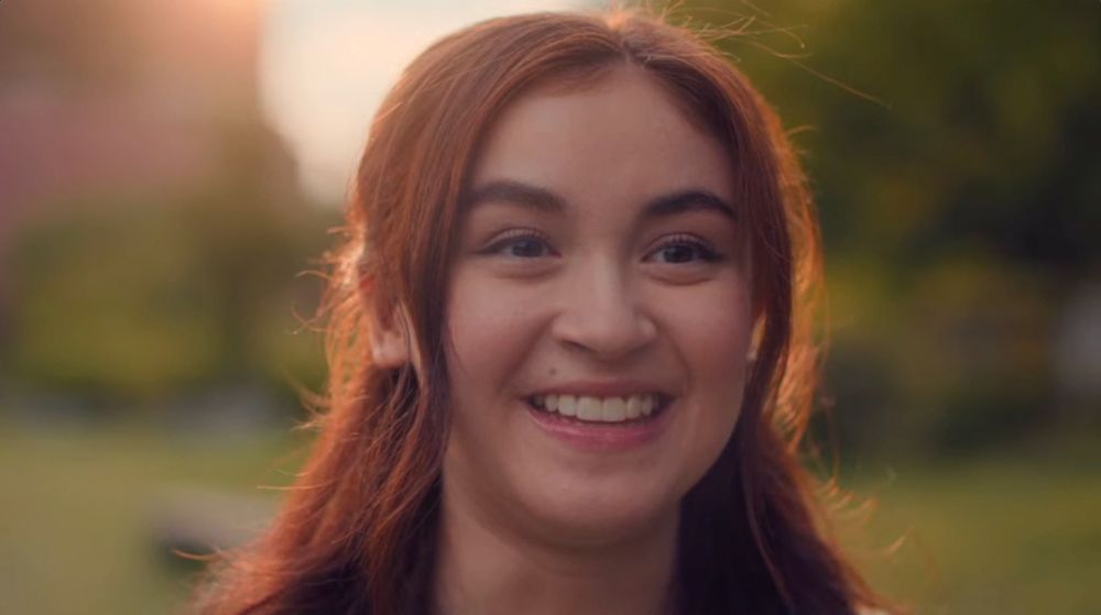 Close of up of lead actress, Anna Cathcart, backlit by the sun. 