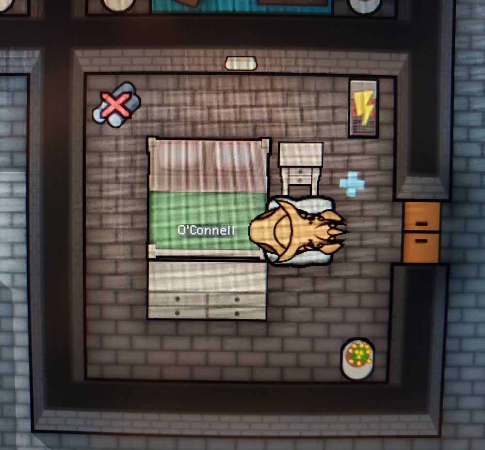 Image from Rimworld of O'Connell's bedroom, containing a bed, table, dresser, and an animal bed containing the large brown insect
