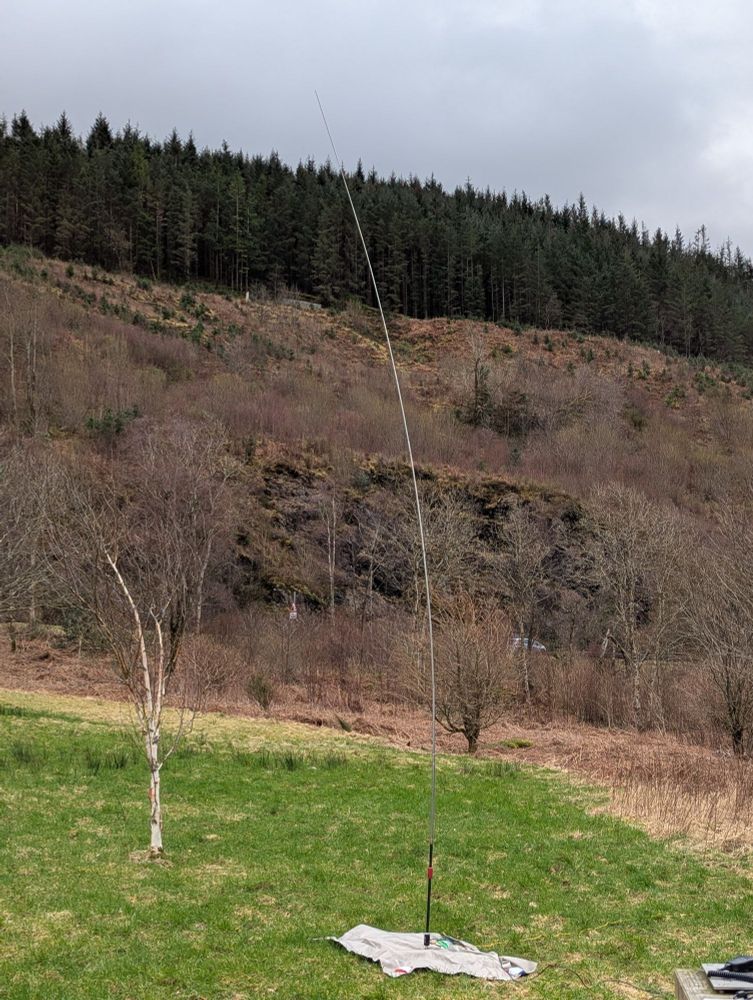 Antenna being blown about in the wind.