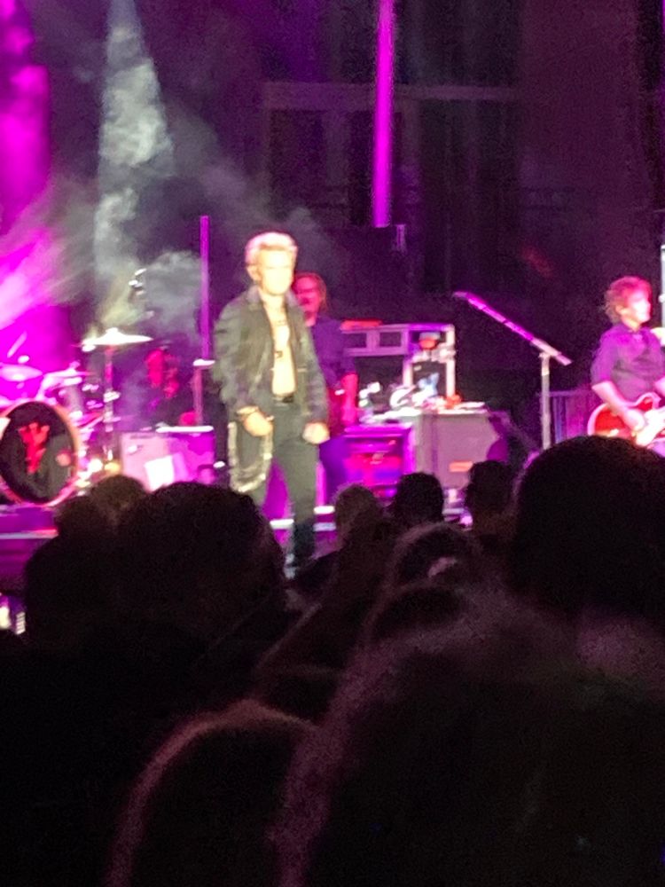 Singer Billy Idol singing “Rebel Yell” in concert in front of admiring crowd in Spokane, WA August 2024.