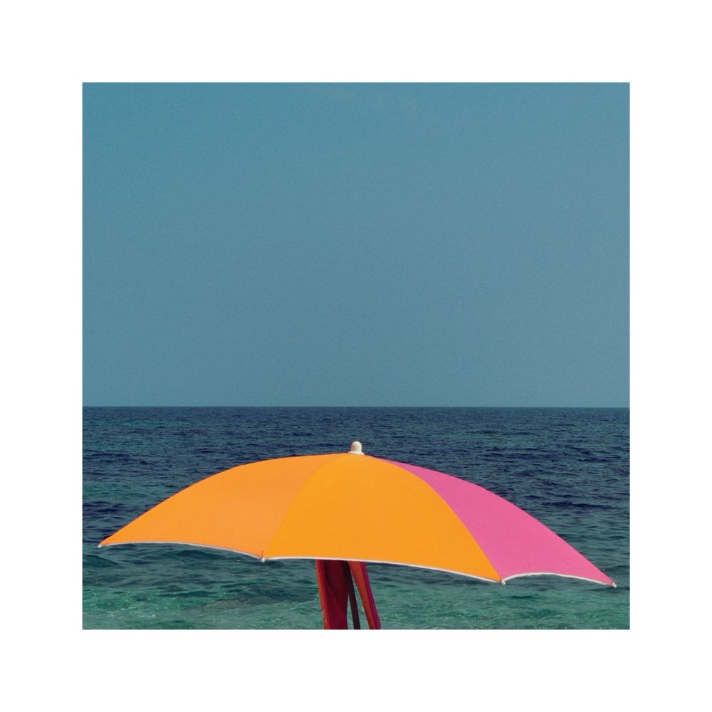 the square frame is divided into two horizontal stripes, the upper 2/3 showing the turquoise sky, the lower 1/3 showing the blue ocean. in front of the ocean there's also sitting a colorful sun umbrella filling almost the whole width of the frame. it is slightly angled compared to the rest of the scene