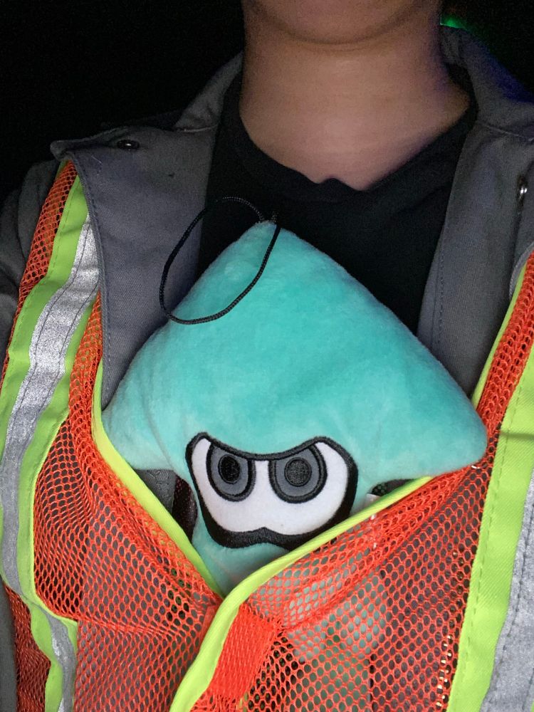 splatoon squid plush sitting in my costume