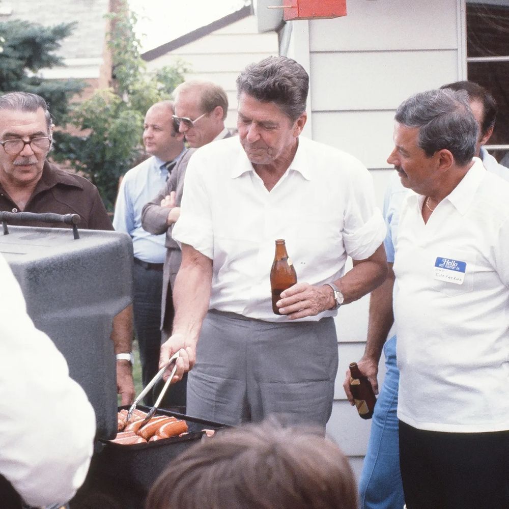 Reagan holding a beer and barbecuing 