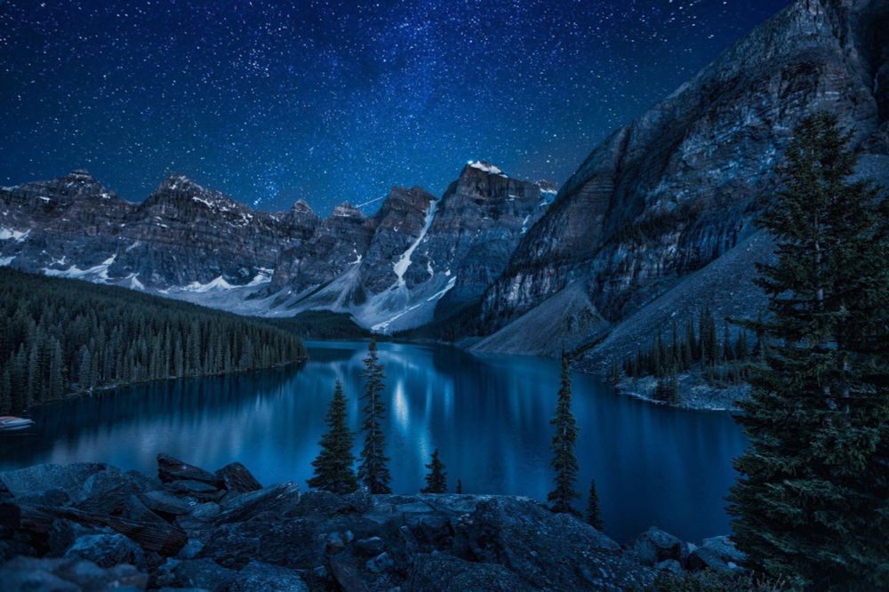 Mountain lake, starlit sky 