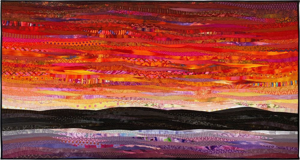 Dayspring is a pieced art quilt that creates the sunrise against a dark horizon. Bound to make a statement in your home or office. #etsy #craftcouncil #womensartofbluesky #pieced #originalquilt #textile