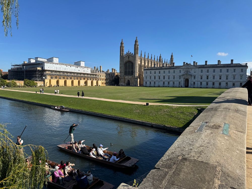 Traditional view from left bank of King’s bridge over the back lawn to the chapel and Gibbs building 