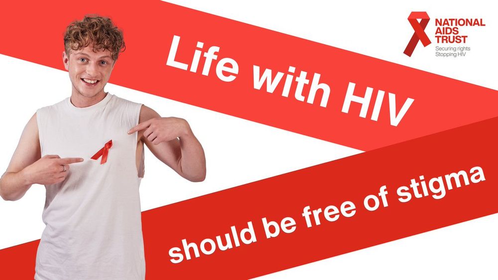 Life with HIV should be free of stigma. 

Picture of a man with a red ribbon. 

National aids trust logo. Red ribbon. Securing rights, stopping H.I.V. 