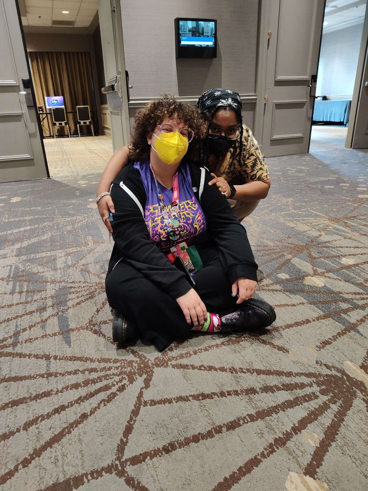 two people (me and anarchy) sitting on the floor and hugging