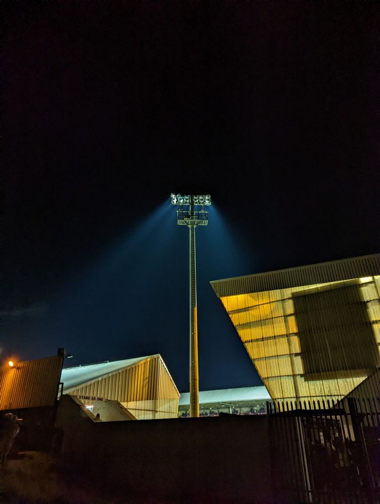 Dunfermline Athletic's East End Park under floodlights.