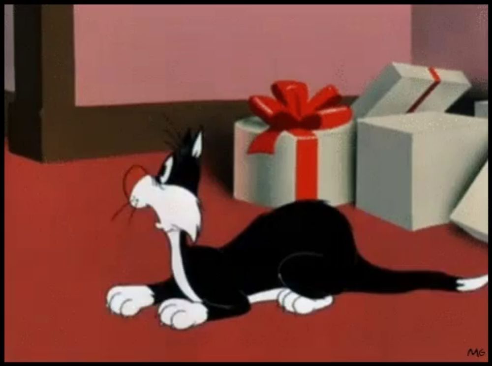 a black and white cartoon cat is laying on the floor next to gifts .