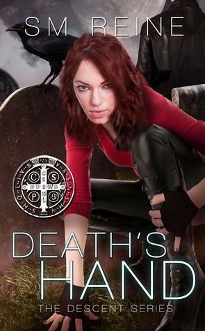 The image shows the book cover of "Death's Hand" by SM Reine, part of The Descent Series. The cover features a young woman with red hair wearing red and black clothing in an action pose. The background shows a raven on a headstone and a shadowy figure, while the foreground has a circular seal visible. The overall aesthetic is indicative of urban fantasy or paranormal fiction.