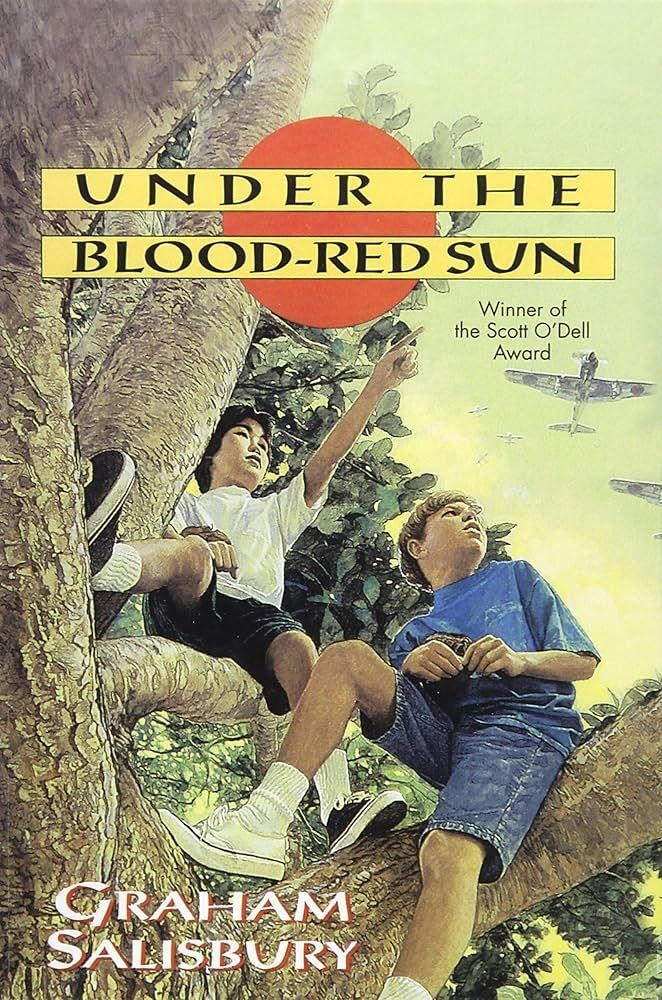 Book cover of "Under the Blood-Red Sun" by Graham Salisbury. The cover shows two young boys sitting in a large tree, looking up at military planes flying overhead. A large red sun appears in the background.