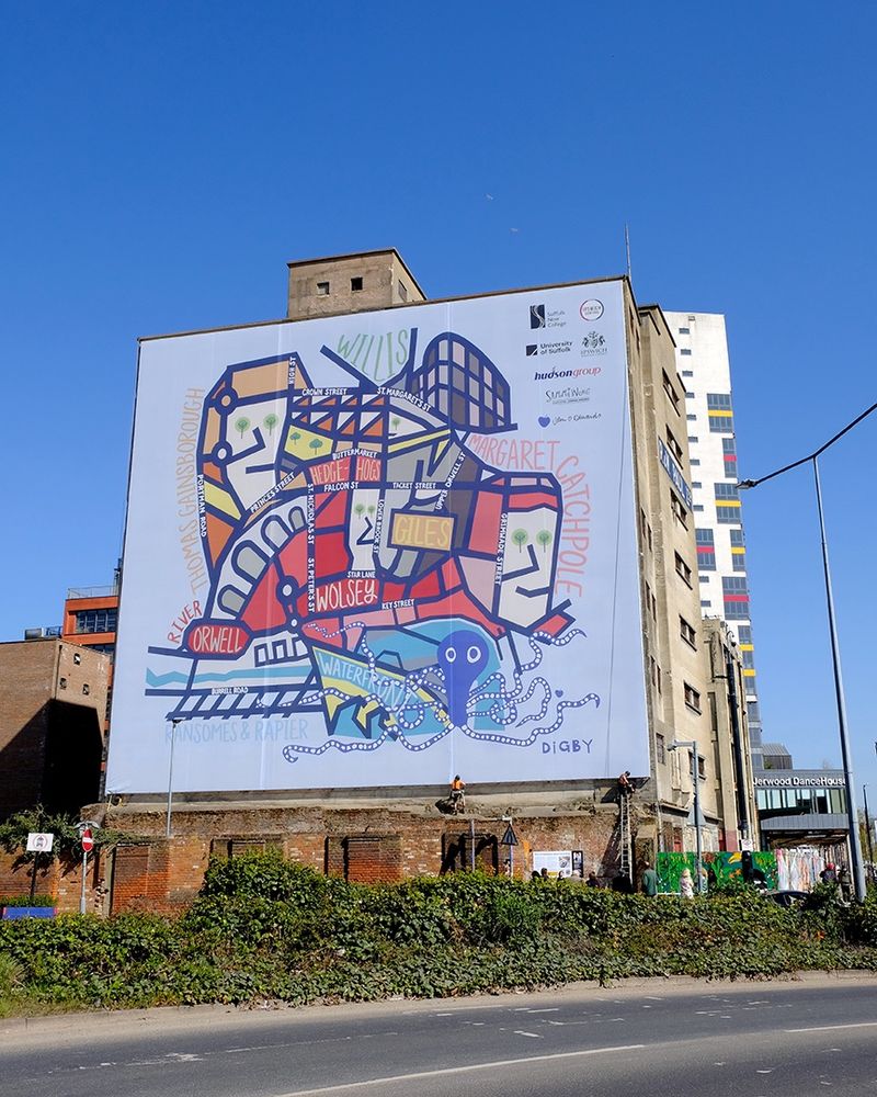 A building with a large colourful map on it side