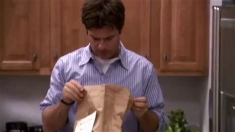 Michael Bluth opens a paper bag, and looks down at its horrifying contents. 