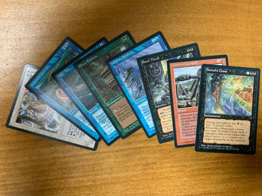 Eight Fallen Empires Magic the Gathering cards. Order of Leitbur, Homorid Warrior, High Tide, Elven Fortress, Vodalian Soldiers, Basal Thrull, Dwarven Catapult, and Tourach’s Chant.