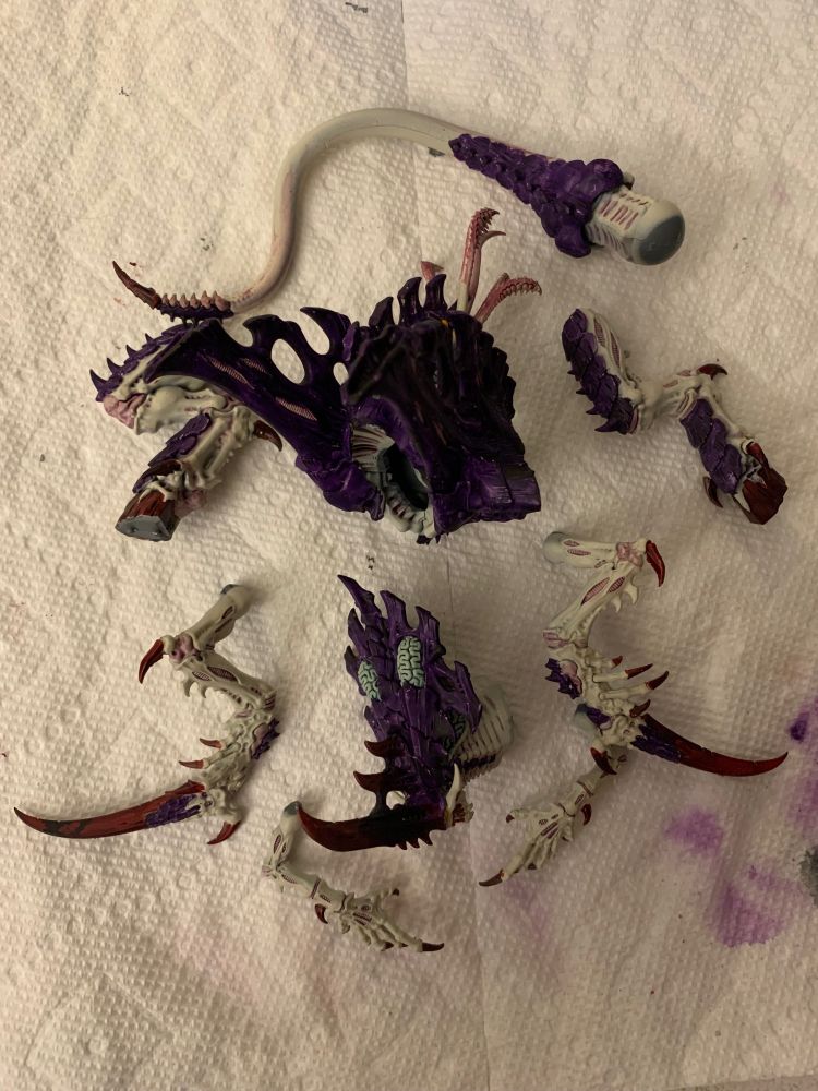 Mostly painted Tyranid Norn Emissary, in sub-assembly, with limbs, torso, head, and tail separate.