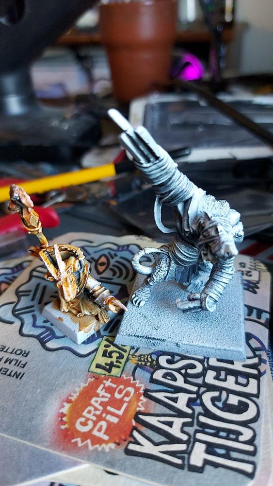 A primed and partially painted classic Skaven Grey Seer and a primed classic rat ogre.