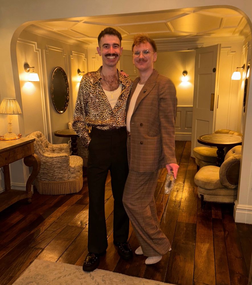 pic of Reece and Carrot dressed up fancy in an even fancier hotel bar