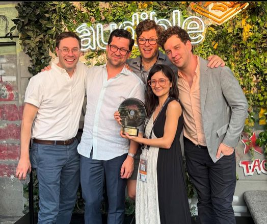 The Mission to Zyxx crew pose with their Best Audio Fiction award. They are perfect.