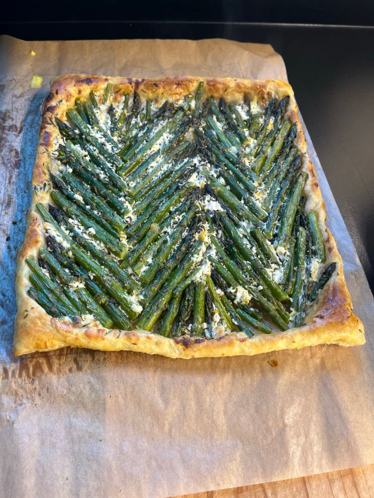 Puff pastry tart with asparagus arranged in a chevron pattern