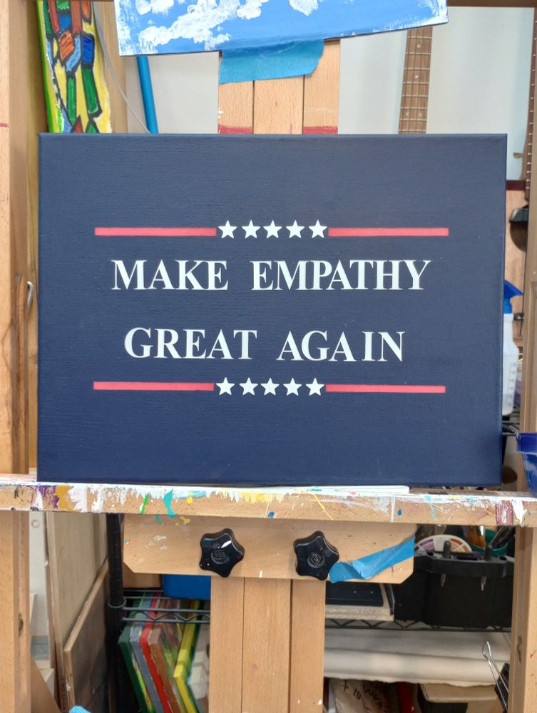 Protest sign says make empathy great again 