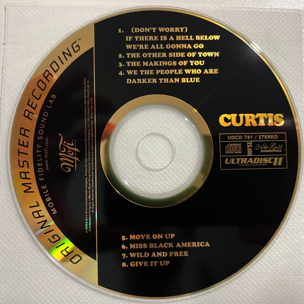 Face of a gold compact disc with the mobile fidelity name and logo on the left and the album info on the right, all in gold letters against a black background.